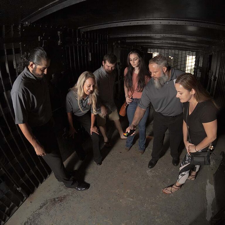 Old Jail After Dark guests participating in investigation inside old jail