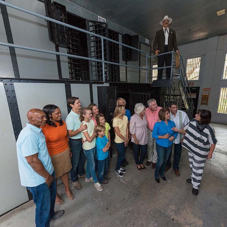 tour guide and guests inside Old Jail