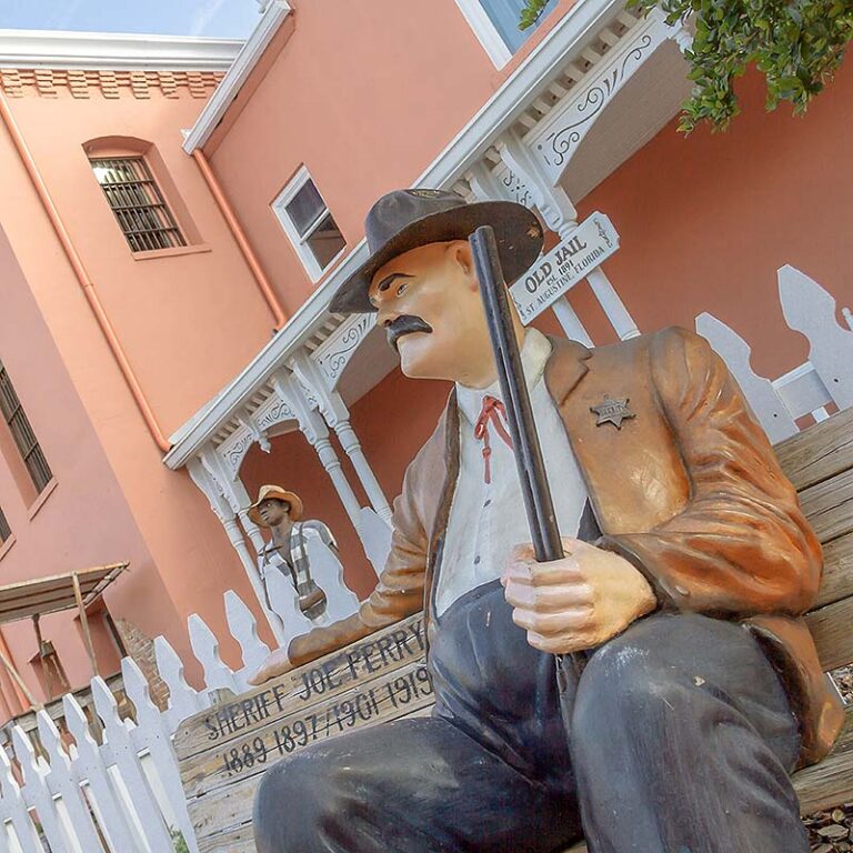 Sheriff Perry sitting outside the Old Jail