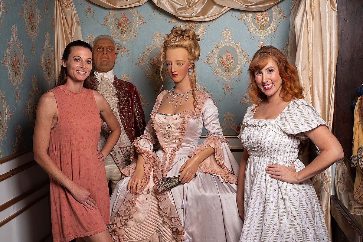 guests at Potter's Wax Museum posing with Marie Antoinette